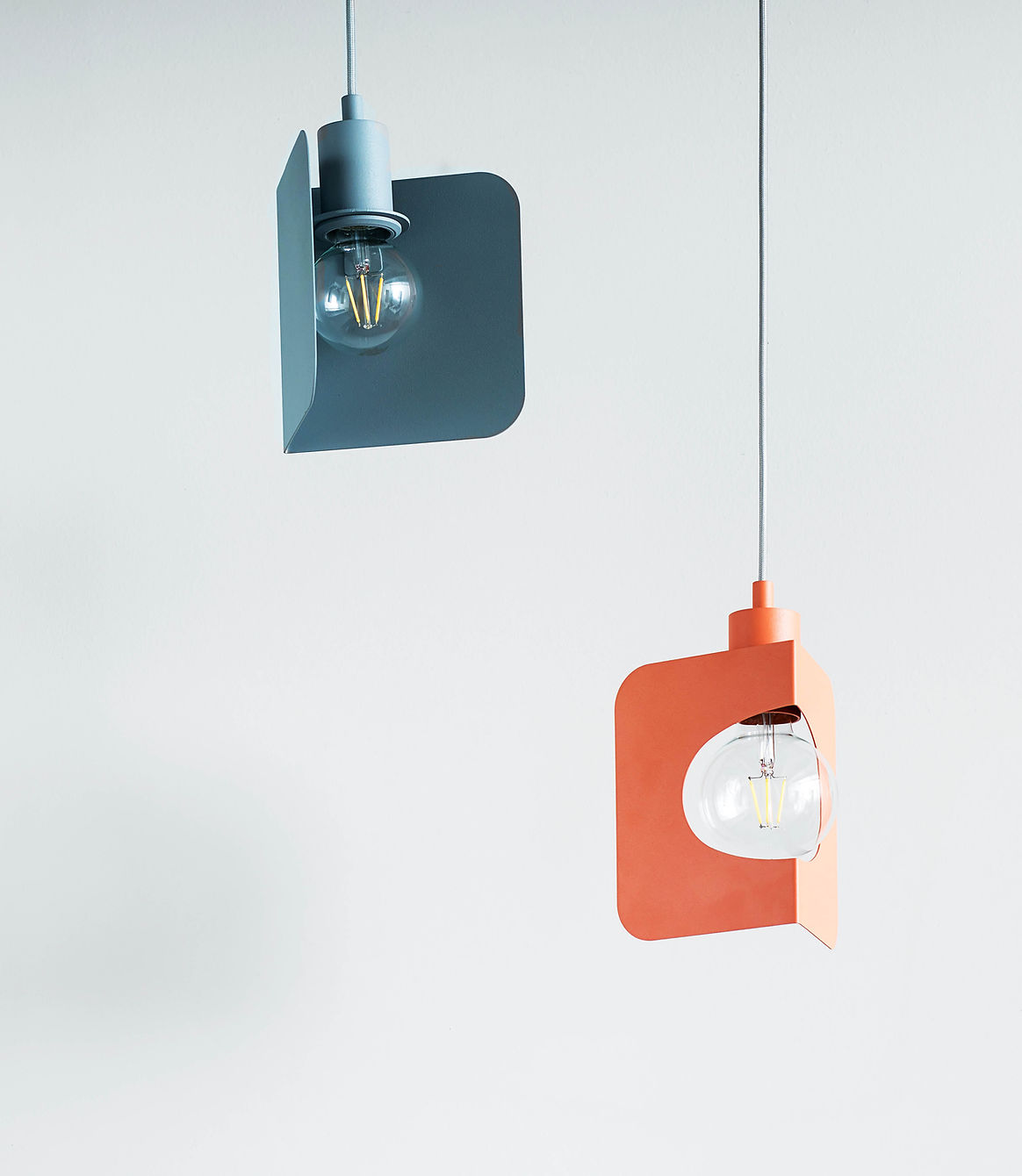 Minimal wall-mounted lamp product on pale background